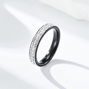 Close-up of black titanium steel ring with double-row sparkling rhinestones