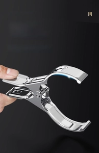 Close-up of a large stainless steel quilt clip showing wide opening and strong spring