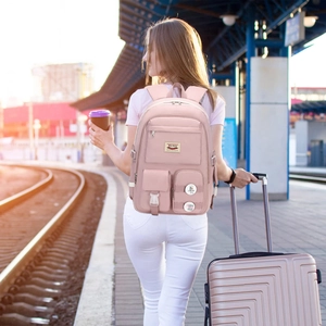 Pink multi-functional backpack for school or travel featuring a spacious multi-pocket design