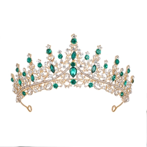 Luxurious gold crown with emerald green crystals and rhinestones for bridal party attire