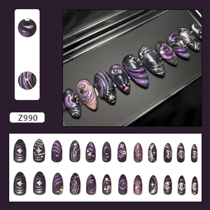Dark purple cat-eye press-on nails with silver stars, glitter, and diamond accents