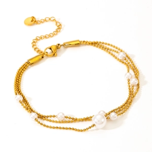 Three-layer gold stainless steel chain bracelet with nine white pearls and adjustable clasp