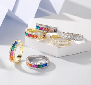 Macro detail of S925 sterling silver half eternity rings with colorful zircon gemstones