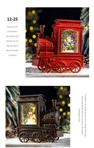 Detailed view of vintage steam train Christmas snow globe lanterns with warm LED lighting