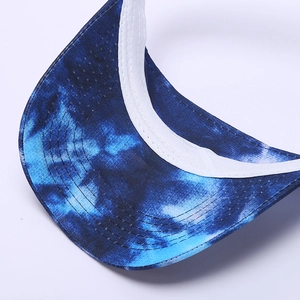 Detailed close-up of blue tie-dye sun hat brim with reinforced stitching and white binding