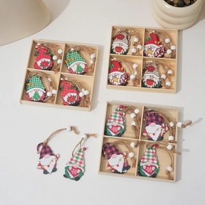 Christmas wooden gnome ornaments set in a decorative box with twine and beads