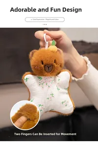 Detail showing interactive double-finger design on the back of brown plush bear puppet