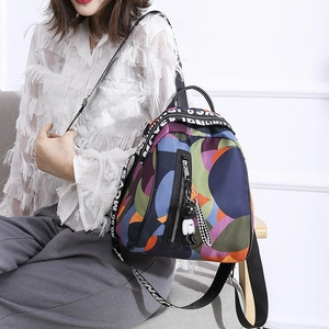 Women's colorful geometric pattern oxford backpack with adjustable straps and astronaut charm