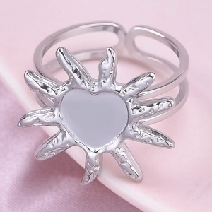 Macro shot of silver sunburst heart ring with adjustable double-layer open band