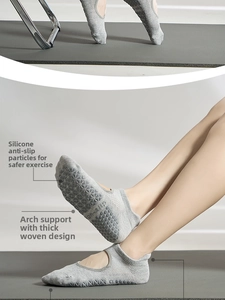 Close-up of cotton yoga socks featuring anti-slip silicone dots and arch support detail