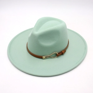 Close-up of mint green fedora hat featuring a brown leather strap and gold metal buckle