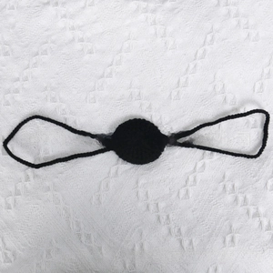Detailed view of hand-crocheted black knit base with elastic loops for nose prop decoration