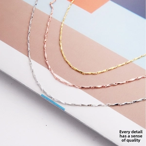 Detail of s925 sterling silver twist chains in silver, rose gold, and gold finishes