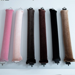 Flat lay of velvet heatless hair rollers in six colors with hooks and elastic bands