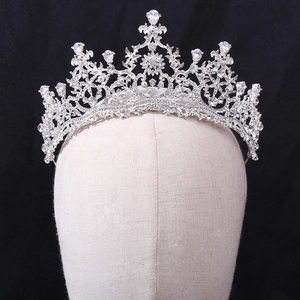 Detailed view of silver bridal crown featuring AAA cubic zirconia and floral filigree motifs