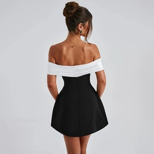 Detail of off-the-shoulder backless design on a black and white contrast mini dress