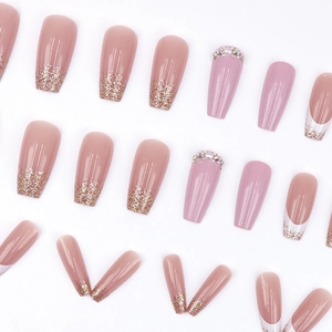 Long coffin press-on nails with pink gradient, gold glitter French tips and rhinestones