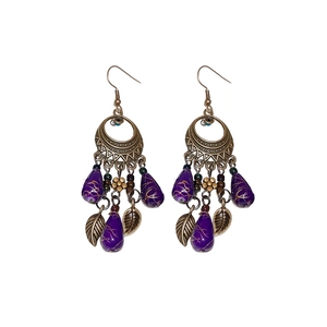 Bohemian bronze leaf earrings with purple teardrop beads and tassel design on white background