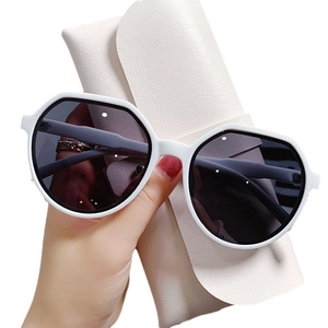 Modern jelly-textured round sunglasses in thick white frame with premium leather case