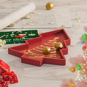 Christmas tree shaped red festive snack tray with gold Merry Christmas lettering