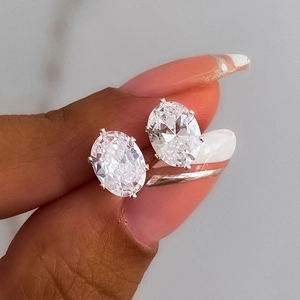 Close-up of oval-cut zircon earrings with four-prong setting on s925 silver base