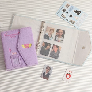 Detail of purple plush A5 photo album with heart embroidery and magnetic buckle closure