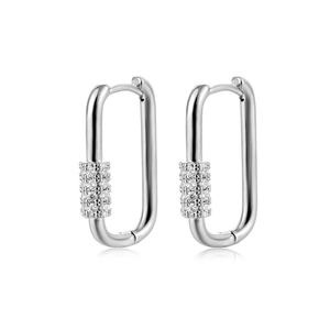Macro shot of silver rectangular U-shaped earring with paved zircon stones