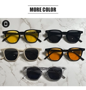 Flat lay of retro square sunglasses in multiple colors including yellow and tea lenses