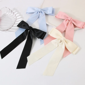 Set of four large satin bow hair clips in black, light blue, pink and off-white colors