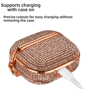 Macro detail of rose gold rhinestone AirPods case showing precise charging port access