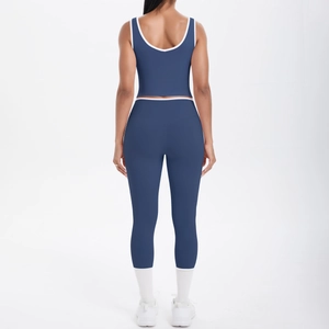 Two-piece navy blue yoga set with high-waisted cropped leggings and U-back racerback tank top