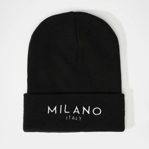 Black knit beanie hat with white MILANO ITALY embroidery on the cuffed edge for winter