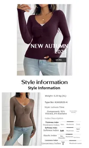 Detail of V-neck long sleeve top with button placket and ribbed fabric texture