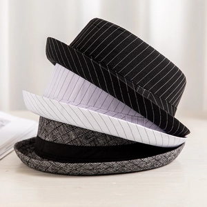 Three stylish striped jazz fedora hats for men in black, white, and grey woven textures