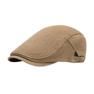 Vintage khaki cotton newsboy cap with metal buckle on white background side view
