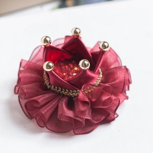 Kids crown headpiece in burgundy ribbon with golden beads and chains on white background