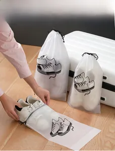 Frosted waterproof drawstring storage bag showing white sneakers being packed for travel