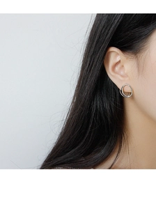 Close-up of minimalist S925 sterling silver earrings with irregular double loop design