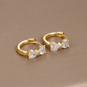 Macro shot of 18K gold plated bow earrings with sparkling pave-set cubic zirconia