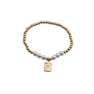 Elegant gold bead and pearl bracelet with a rectangular H letter pendant on white background