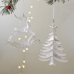 Sparkling reindeer and Christmas tree hanging ornaments with silver glitter and white ribbon