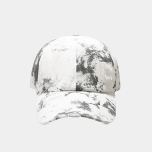 Distressed tie-dye baseball cap in black and white with vintage ripped details