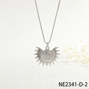 Close-up of silver punk sun pendant necklace with sparkling cubic zirconia on box chain
