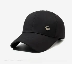 Detail view of the black cotton baseball cap showing the fashion metal emblem on the side
