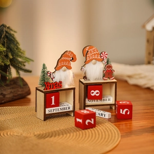 Detail of wooden Christmas countdown calendar with gnomes, blocks and Xmas lettering