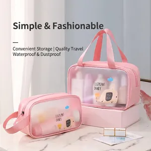 Pink waterproof PVC makeup bag set with cute cartoon print and sturdy PU handles