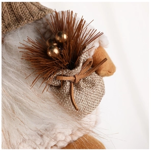 Close-up of a Christmas gnome detail with knitted hat, white beard, and burlap sack pouch