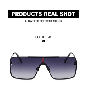 Detail of square aviator sunglasses with black metal frame and red striped bridge logo