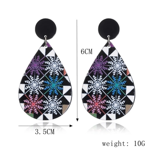 Detail view of teardrop Christmas earrings featuring colorful snowflake patterns and size 6CM