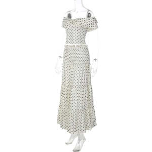 Detailed close-up of polka dot off-shoulder top and layered maxi skirt set with ruffles